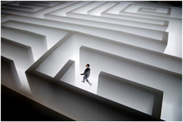 Man walking in bright white maze